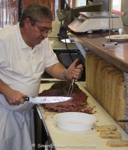 Slicing Smoked Meat for a Sandwich