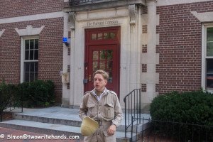 Guide Cameron Goslin in front of the Harvard Crimson