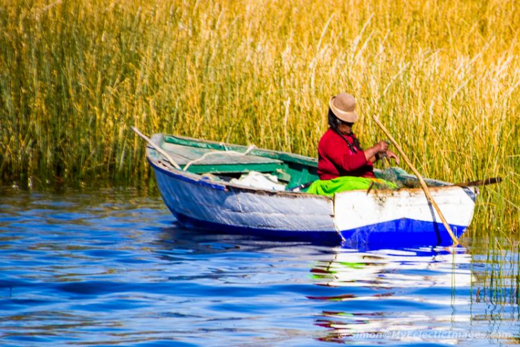 Peruvian Lady Fishing in the Reed Beds Around Uros on Lake Titicaca (©simon@myeclecticimages.com)